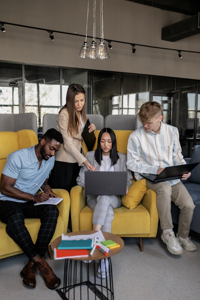 A diverse group of coworkers engaged in a collaborative meeting in a modern office space.